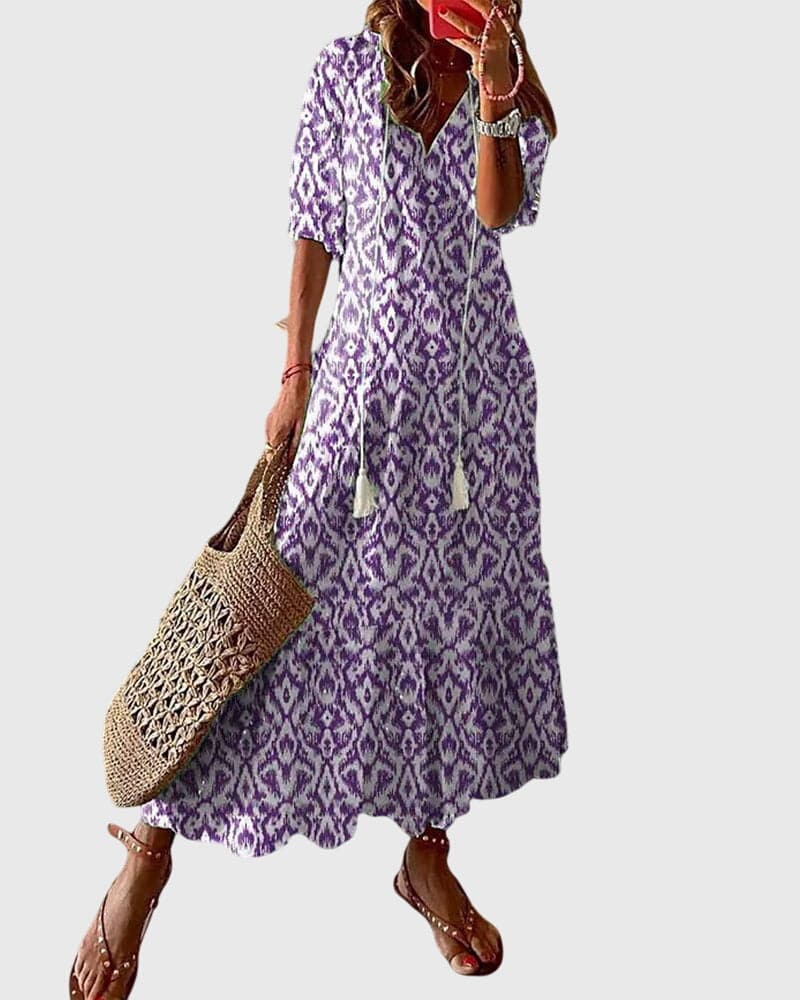 Emma & Rose Cape Town Amalia™ boho vintage summer dress with floral pattern and flowing fabric, perfect for warm weather.