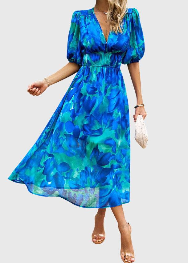 Emma & Rose Cape Town Merlin™ Flattering Floral Midi Dress #1002 Estella with vibrant floral pattern and elegant silhouette.