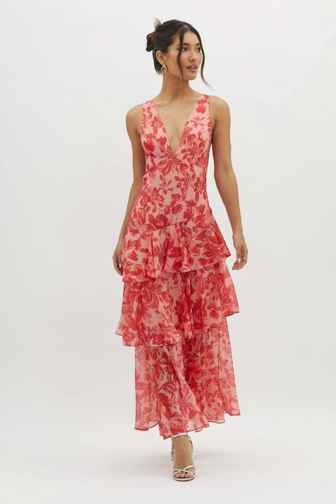 Floral print dress with a deep V-neck by Emma & Rose Cape Town, featuring a lightweight fabric and vibrant flower pattern.