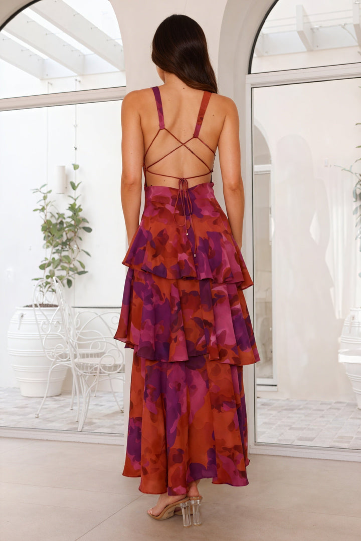 Floral print dress with deep V-neck by Emma & Rose Cape Town, featuring a flowing fabric and vibrant flower pattern.