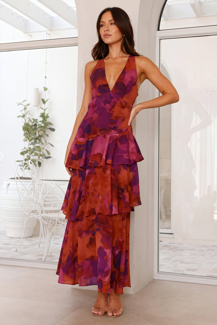 Floral print dress with deep V-neck by Emma & Rose Cape Town, featuring a flowy fabric and vibrant floral pattern.