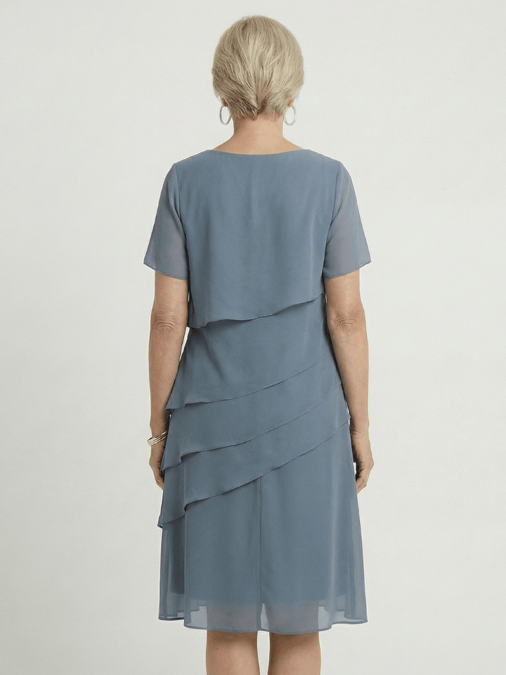 Orson™ Contour Knee Length Dress by Emma & Rose Cape Town, featuring a fitted silhouette and elegant neckline.