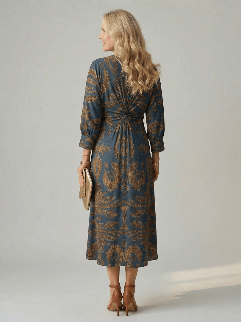 Lune™ Natural Wrap Midi Dress by Emma & Rose Cape Town, featuring flowy fabric and elegant design, displayed on a hanger.