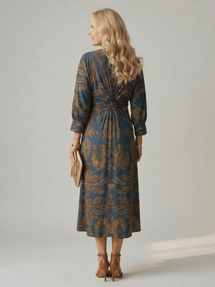 Lune™ Natural Wrap Midi Dress by Emma & Rose Cape Town, featuring flowy fabric and elegant design, displayed on a hanger.