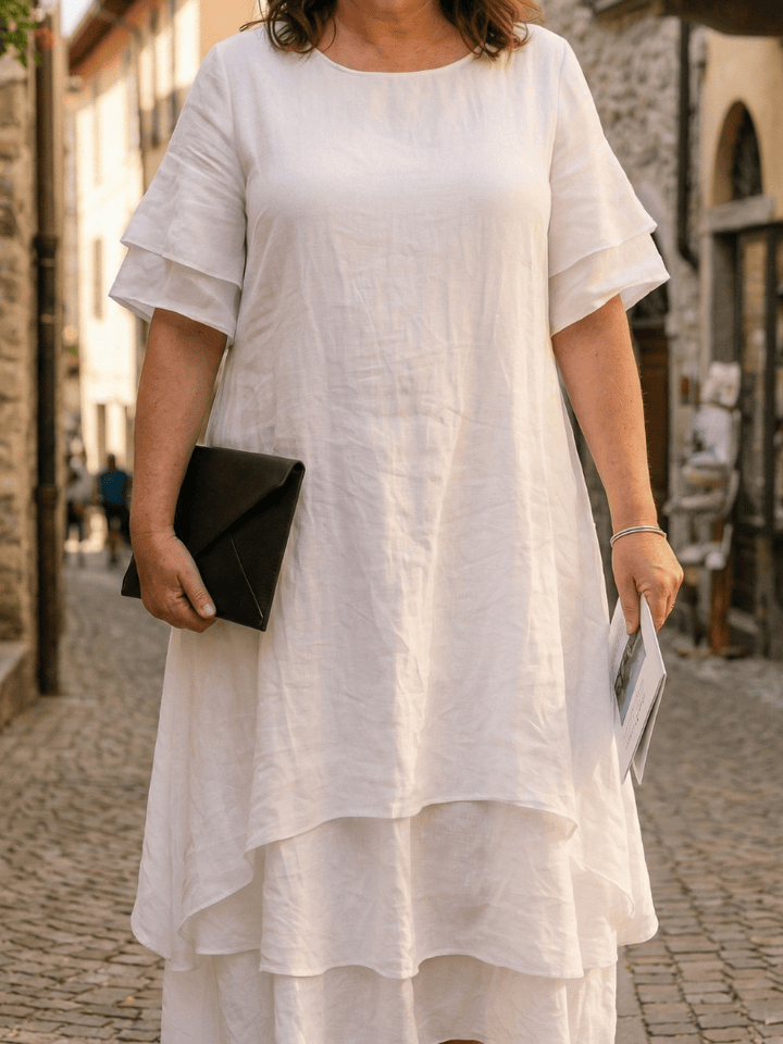 Soft layered Belen™ dress by Emma & Rose Cape Town featuring flowing fabric and elegant design.