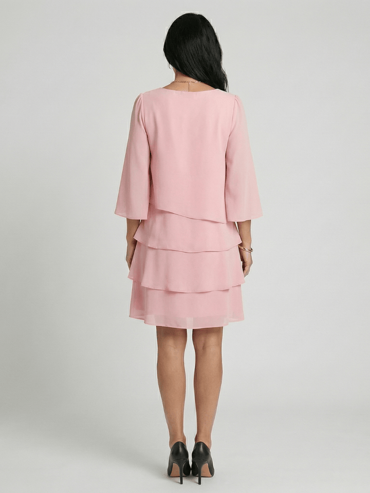 Della™ sleeve knee-length dress by Emma & Rose Cape Town, featuring a fitted silhouette and elegant design in soft fabric.