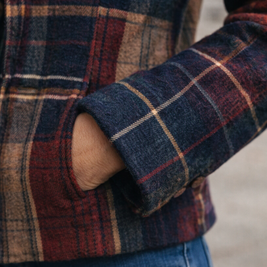 Emma & Rose Cape Town Natalie plaid mid-season coat hanging on a wooden hanger with a cozy, stylish design.