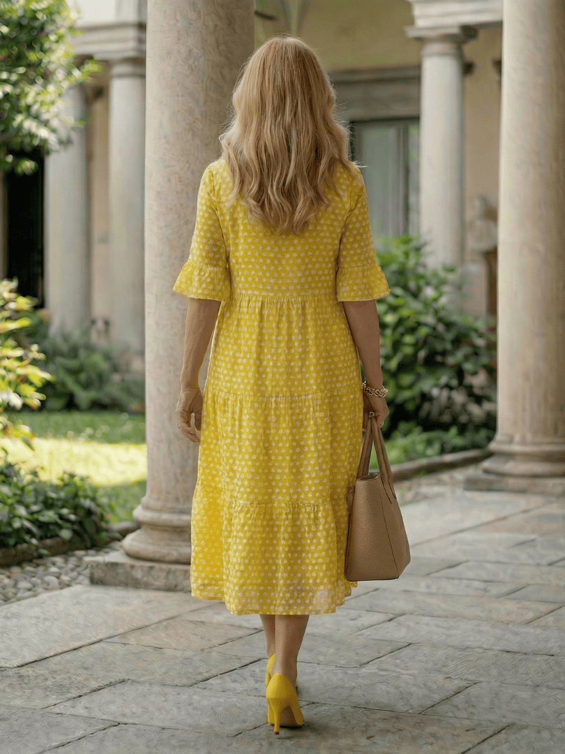 Emma & Rose Cape Town Arlo™ Dot Tiered Midi Dress featuring a lightweight fabric with a playful dotted pattern and flowy silhouette.