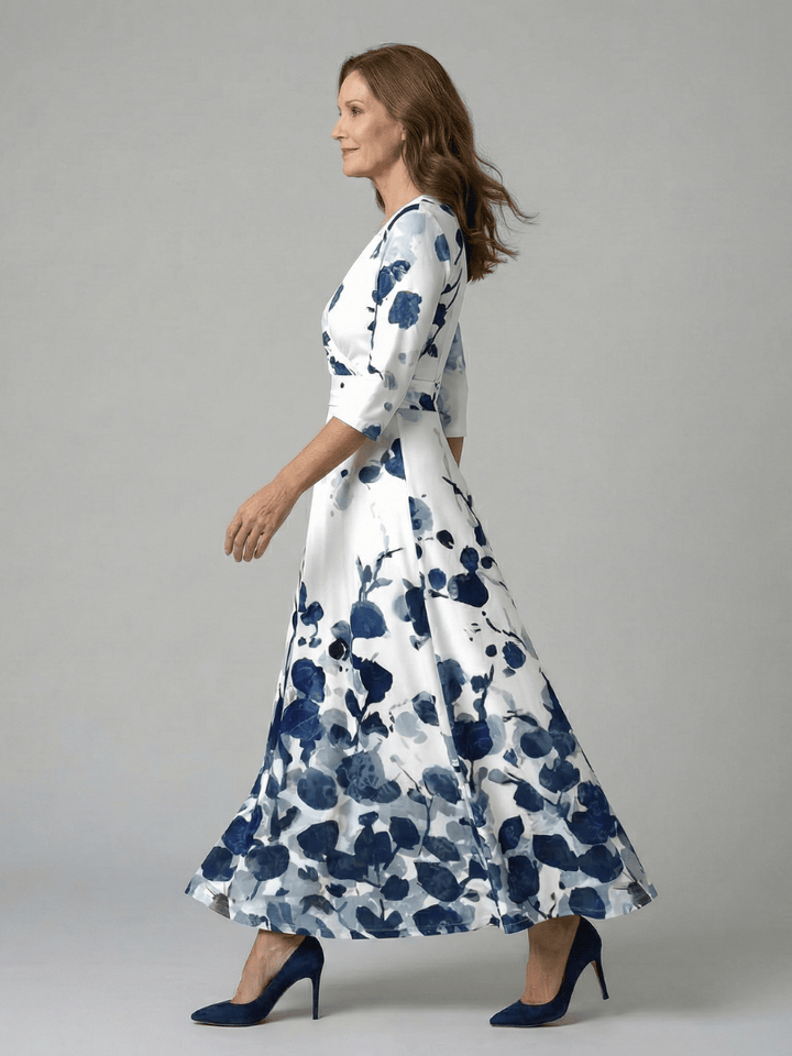 Celine™ wrap neck midi dress by Emma & Rose Cape Town, featuring a flowing silhouette and elegant design, displayed on a hanger.