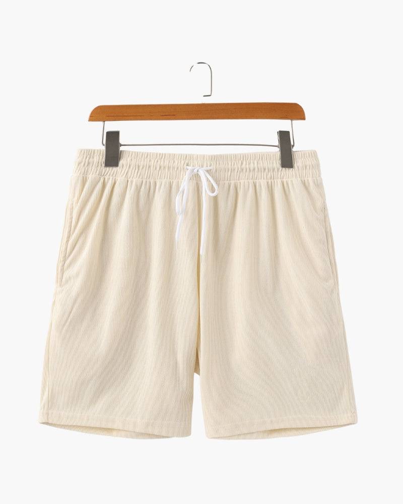 Emma & Rose Manhattan Dean™ Beachstride Shorts in vibrant blue with a relaxed fit and elastic waistband, perfect for summer beachwear.