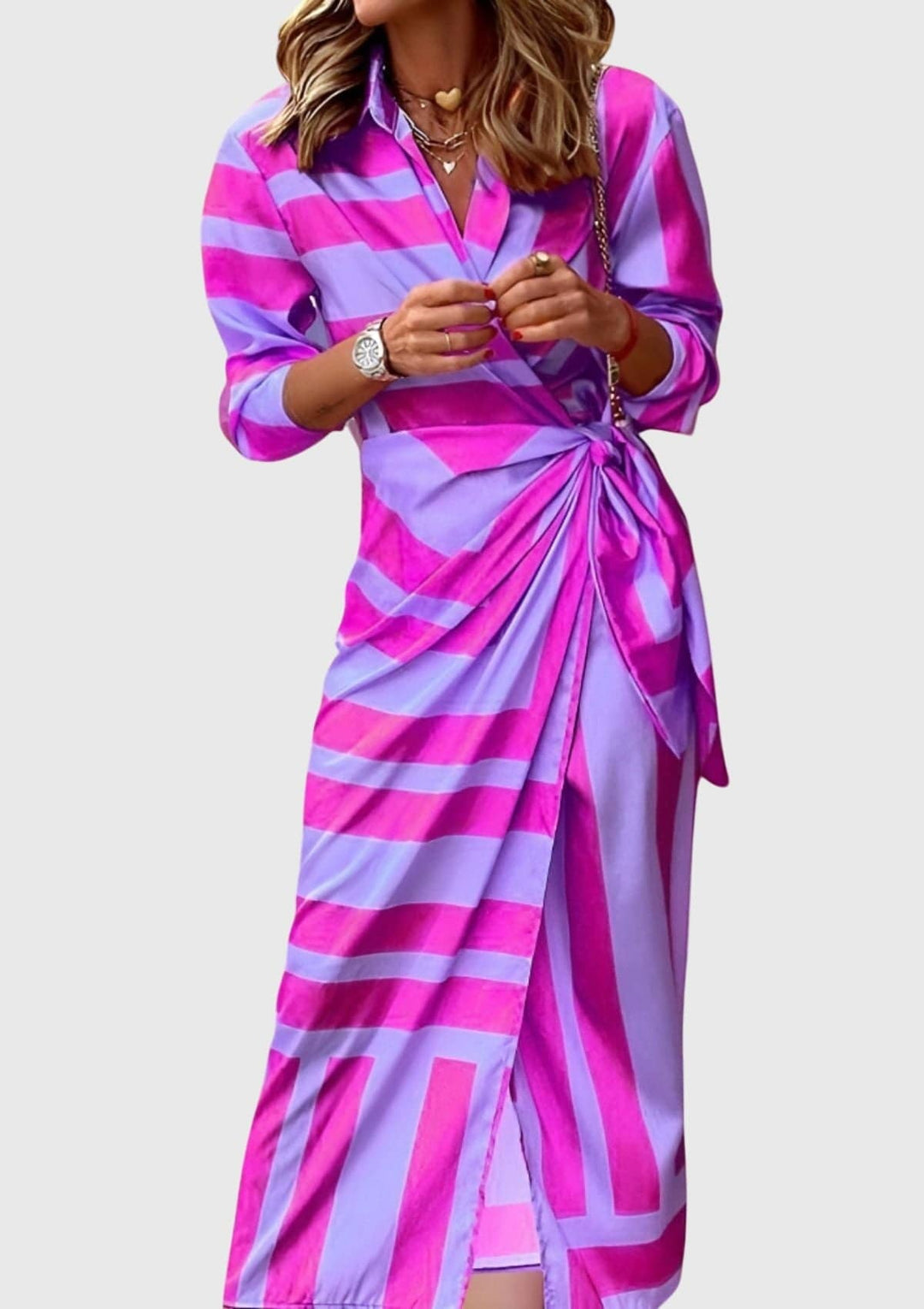 Everly™ elegant wrap dress with floral print by Emma & Rose Cape Town, shown on a model in a stylish setting.