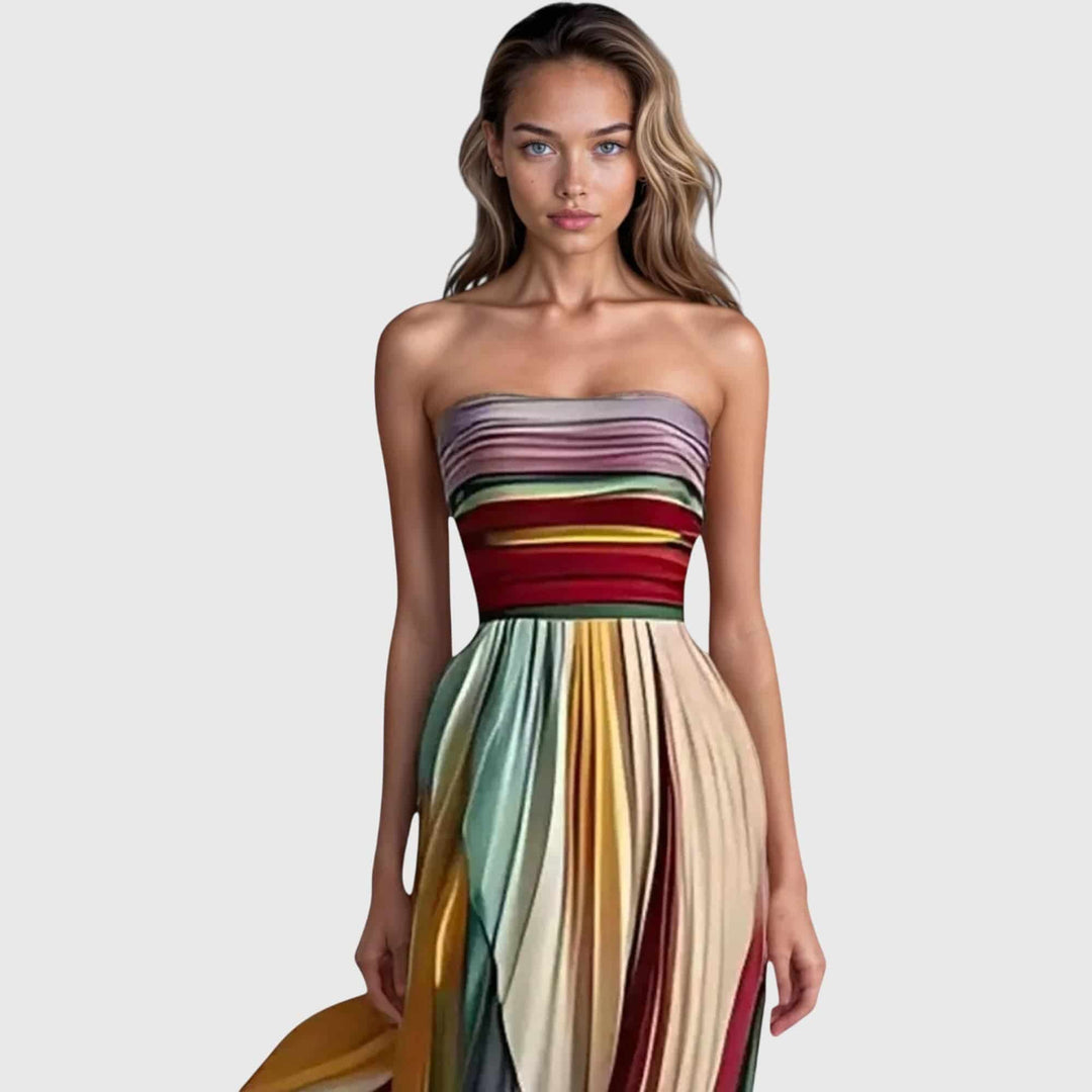 Flora™ premium long dress by Emma & Rose Cape Town, featuring flowing fabric and elegant design, shown on a model.