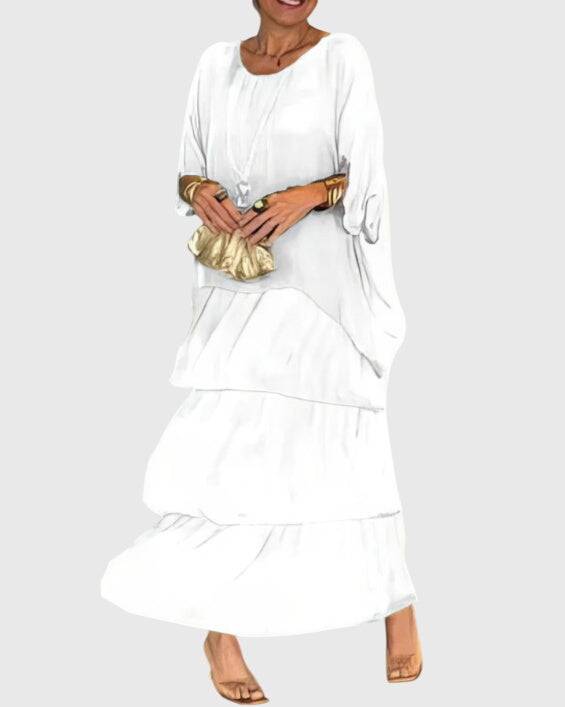 Susan™ long flowing elegant dress by Emma & Rose Cape Town, featuring a graceful, floor-length design with intricate details.