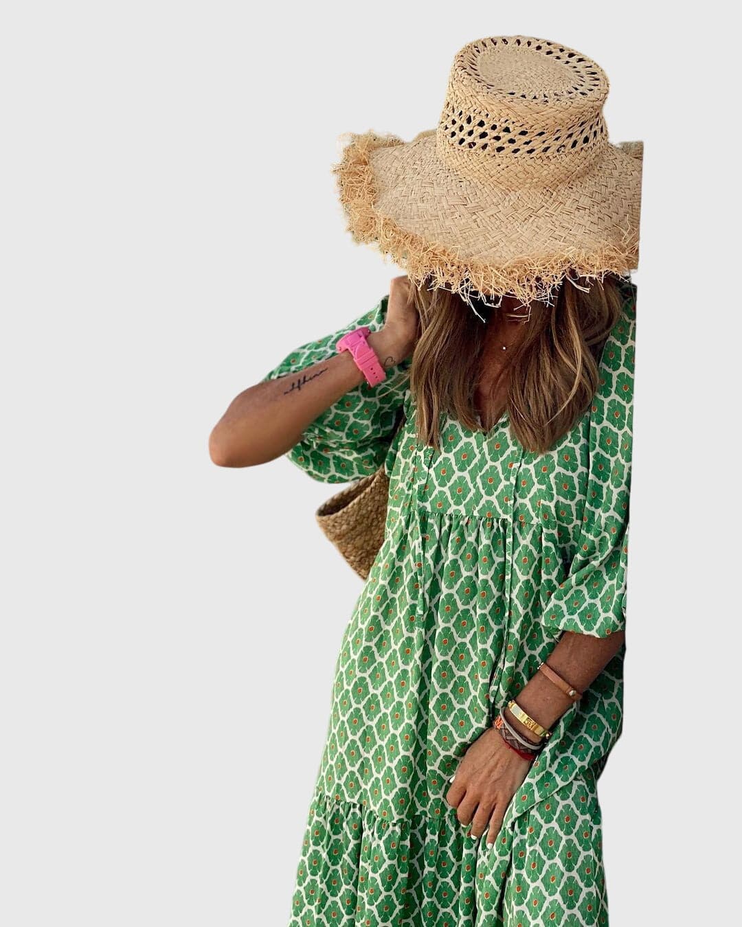 Sarah™ Boho maxi dress by Emma & Rose Cape Town, flowing fabric with bohemian patterns, worn by a model in a sunny outdoor setting.