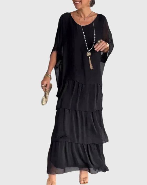 Long flowing elegant dress by Emma & Rose Cape Town, featuring a stylish design perfect for formal occasions.