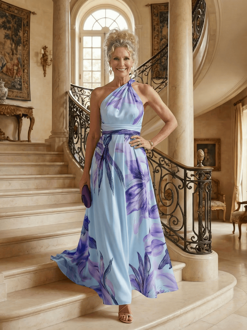 Amiel™ Light Floral Maxi Dress by Emma & Rose Cape Town, flowing fabric with a floral pattern, sleeveless design, and elegant silhouette.