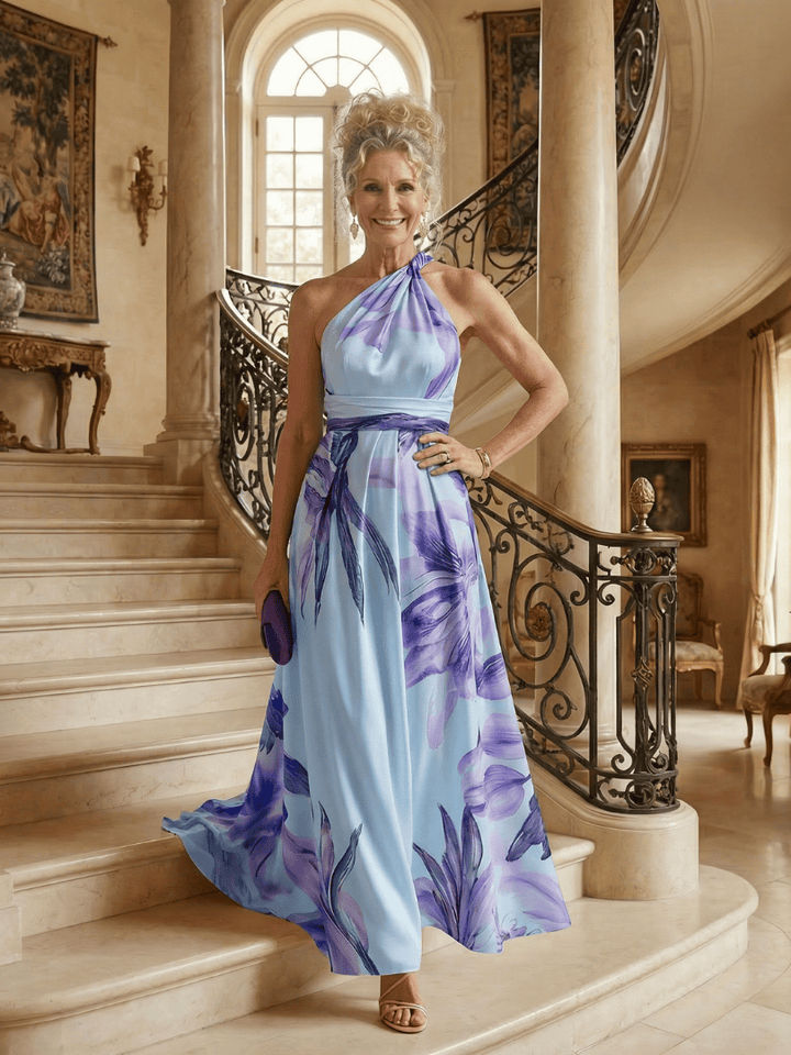 Amiel™ Light Floral Maxi Dress by Emma & Rose Cape Town, flowing fabric with a floral pattern, sleeveless design, and elegant silhouette.