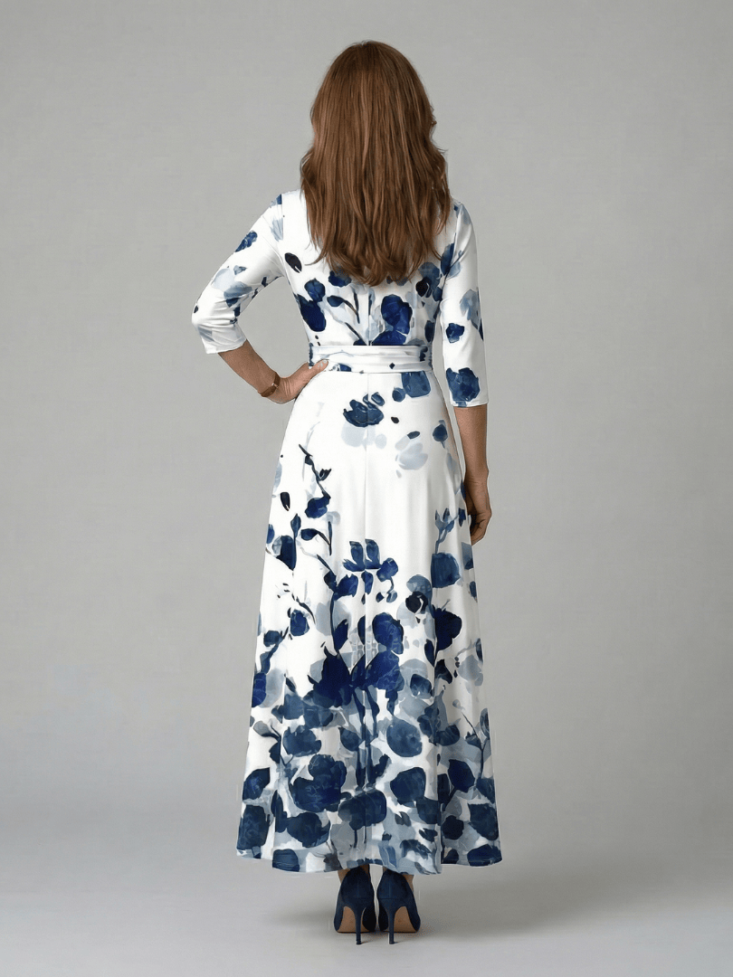 Celine™ wrap neck midi dress by Emma & Rose Cape Town, featuring a flowing silhouette and elegant design, shown on a model.