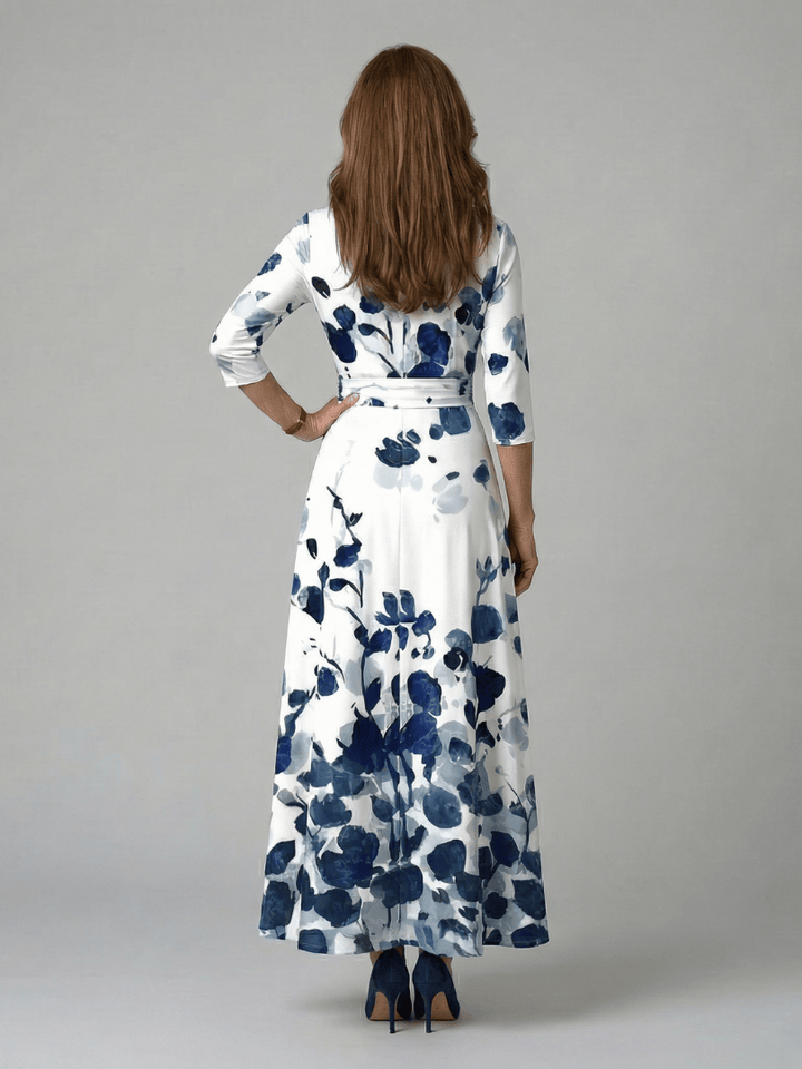 Celine™ wrap neck midi dress by Emma & Rose Cape Town, featuring a flowing silhouette and elegant design, shown on a model.