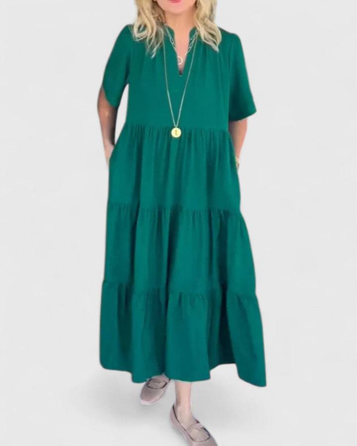 Rebecca™ elegant maxi dress by Emma & Rose Cape Town, flowing fabric and stylish design, shown on a model.