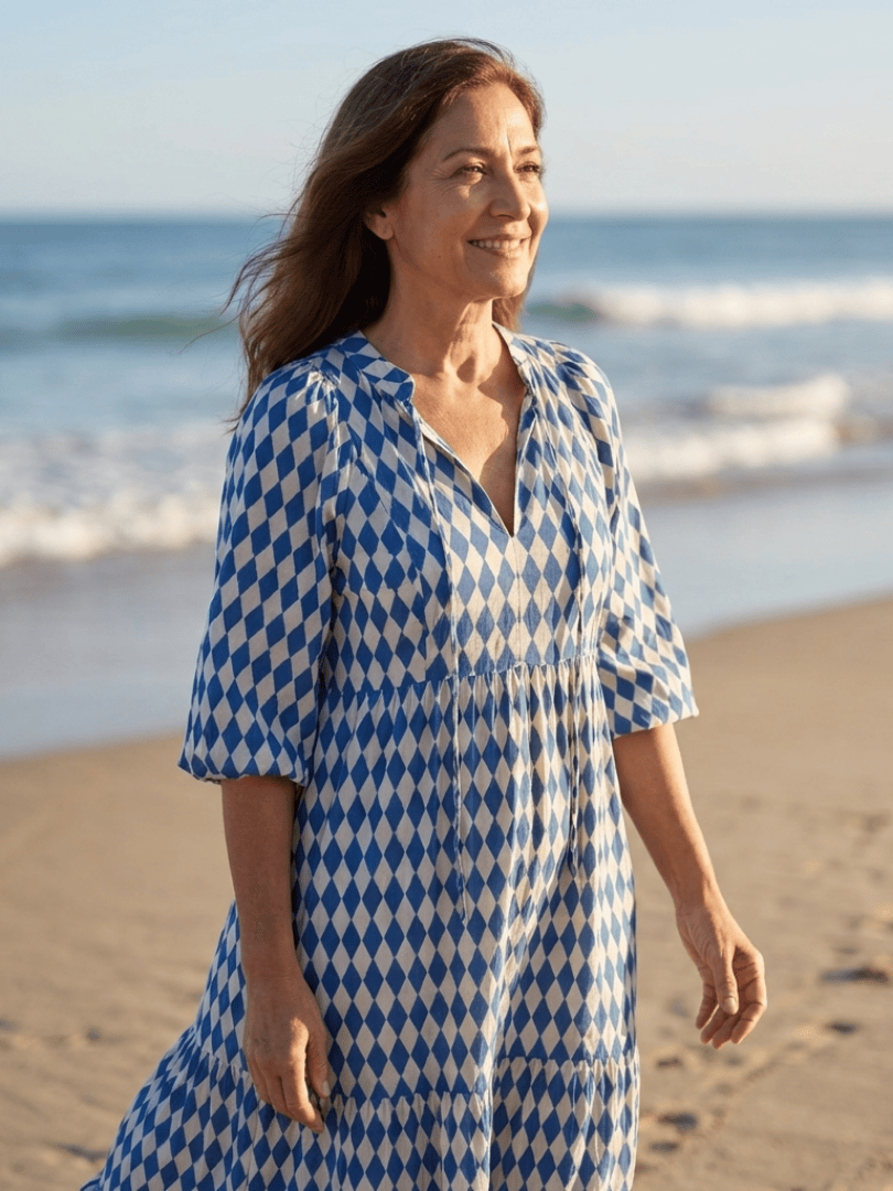 Elodie™ Print Tiered Midi Dress by Emma & Rose Cape Town, featuring a flowy, tiered design with vibrant floral print.