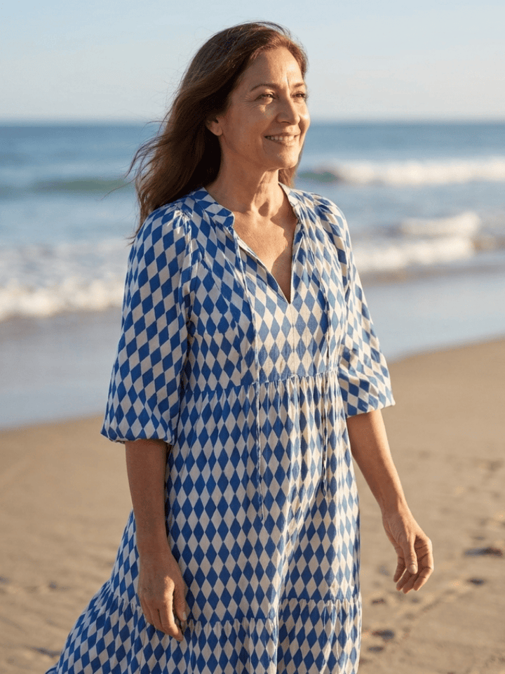 Elodie™ Print Tiered Midi Dress by Emma & Rose Cape Town, featuring a flowy, tiered design with vibrant floral print.