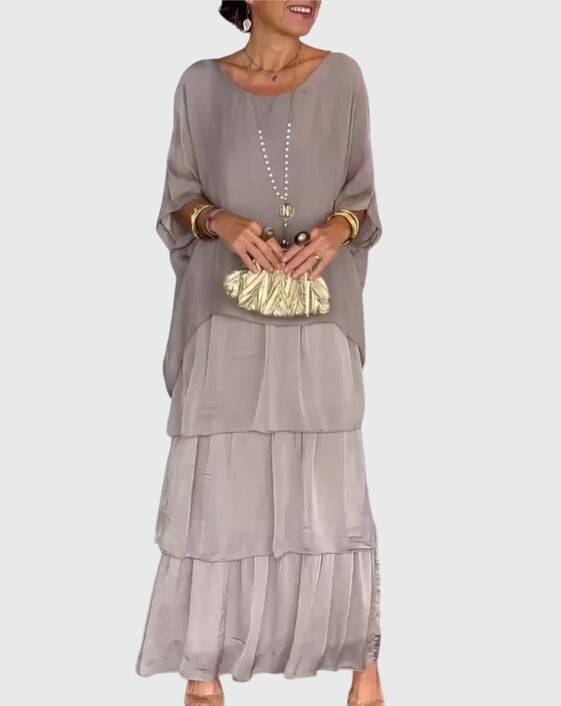 Elegant Susan™ long flowing dress by Emma & Rose Cape Town, featuring a graceful silhouette and intricate fabric details.