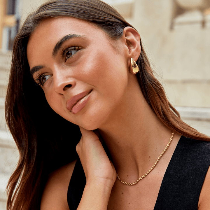 Emma & Rose Cape Town Luna™ Stiliga Gold Earrings featuring elegant teardrop design in shiny gold finish.