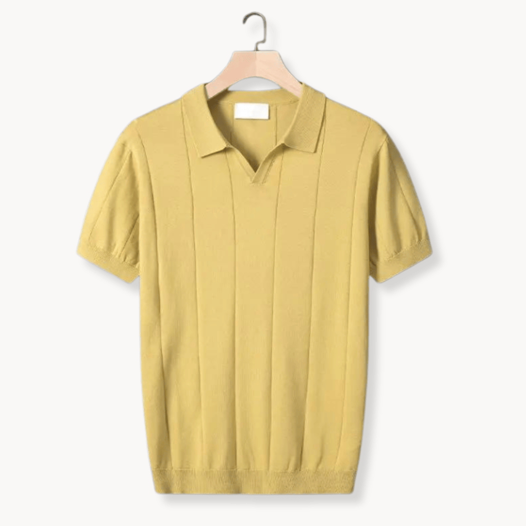 Emma & Rose Manhattan Portofino™ soft polo shirt in a light color, displayed on a hanger.