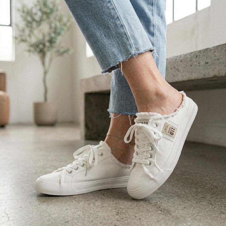 Emma & Rose Cape Town cowboy mule slippers in white leather with decorative stitching and a slip-on design.