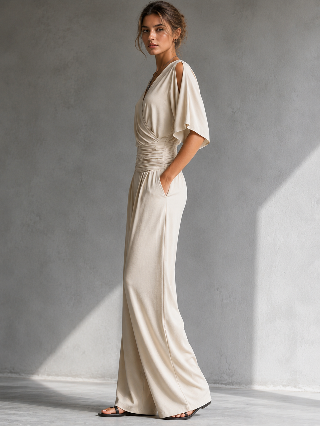 Elegant women's jumpsuit with a crossover V-neck and wide pants
