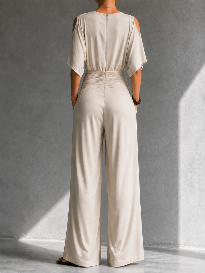 Elegant women's jumpsuit with a crossover V-neck and wide pants