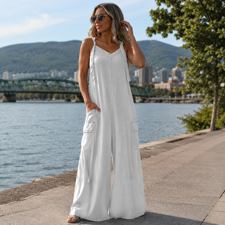 Long women's flowy dress with adjustable straps and cargo pockets
