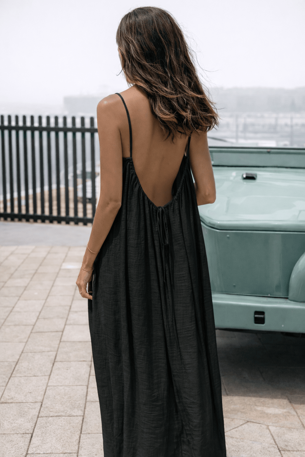 Velle Noir Mora™ backless maxi dress by Emma & Rose Cape Town featuring a flowing silhouette and elegant backless design.