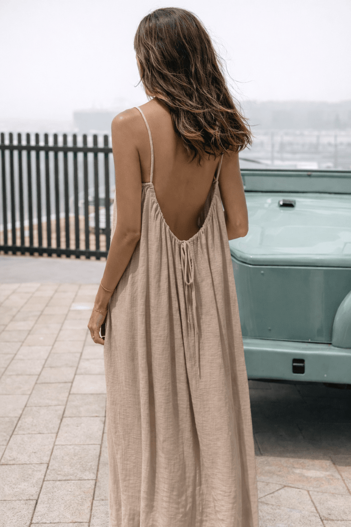 Velle Noir Mora™ backless maxi dress by Emma & Rose Cape Town, flowing black dress with backless design and elegant silhouette.