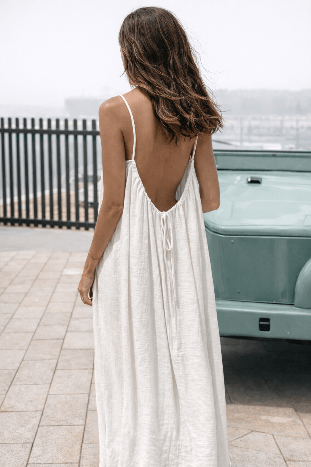 Velle Noir Mora™ backless maxi dress by Emma & Rose Cape Town, elegant black dress with flowing fabric and backless design.
