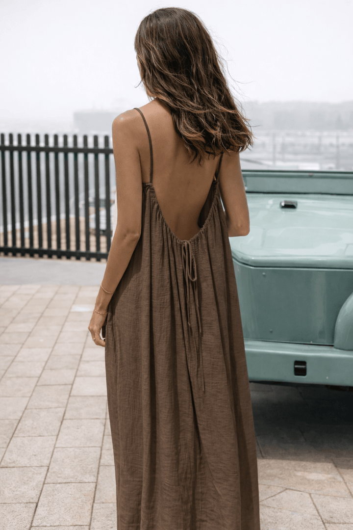 Velle Noir Mora™ backless maxi dress by Emma & Rose Cape Town, flowing black fabric, elegant design, perfect for formal occasions