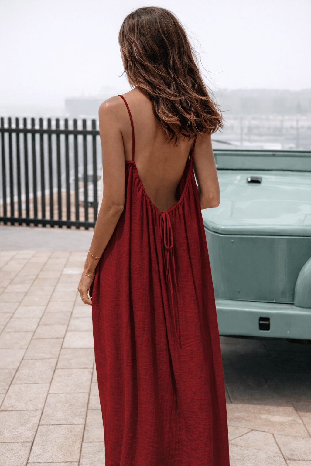 Velle Noir Mora™ backless maxi dress by Emma & Rose Cape Town, flowing black chiffon with open back and elegant silhouette.