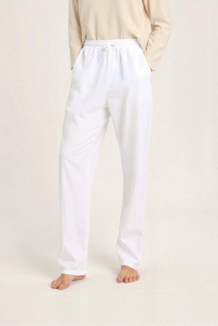 Flat lay of Emma & Rose Manhattan Wendy™ lightweight linen beach pants in natural beige, stylish and comfortable summer wear.