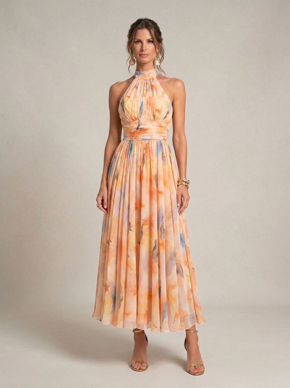 Emma & Rose Cape Town Esther™ halter neck dress with watercolor print, flowing fabric, and stylish design perfect for summer wear.
