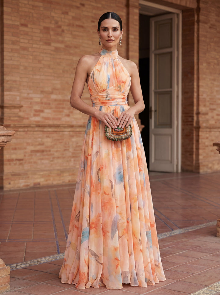 Emma & Rose Cape Town Esther™ halter neck watercolour print dress featuring a flowing silhouette and vibrant floral pattern.
