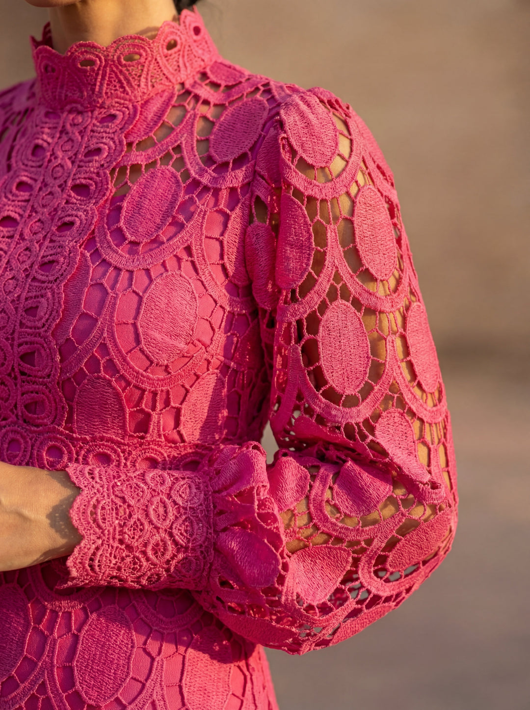 Close-up of Emma & Rose Cape Town Carmona Spring Lace Dress showing intricate lace fabric and delicate stitching details.