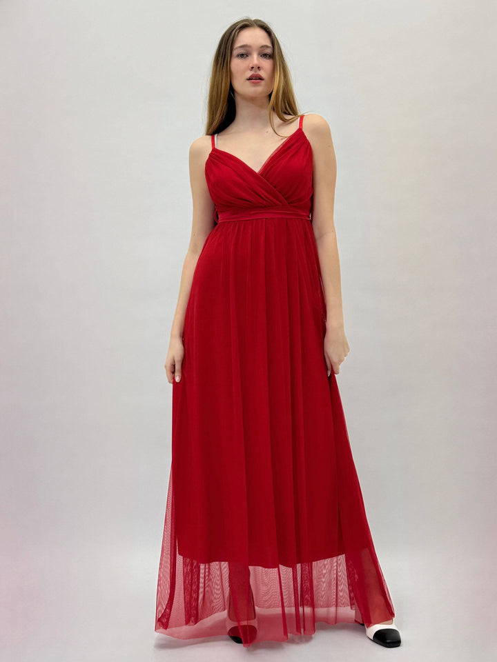 Gisella™ flowing dress by Emma & Rose Cape Town, elegant abiti in soft fabric, displayed on a hanger with natural lighting.