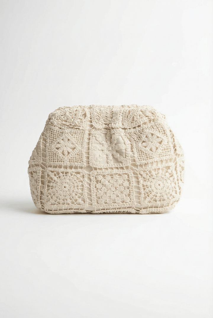 Ophelia™ lace clutch bag by Emma & Rose Cape Town, structured and elegant with romantic lace design, on a white background.