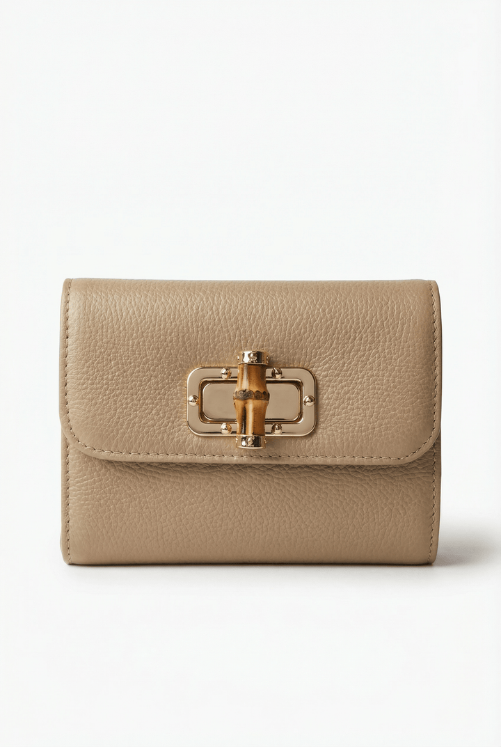 Emma & Rose Cape Town Heleen™ leather pouch bag with elegant closure, standing upright on a white background.