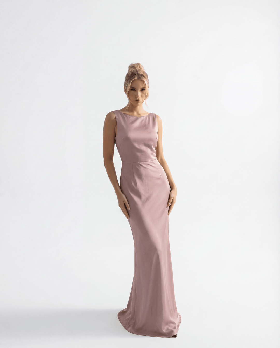 Karla™ long backless ceremony dress by Emma & Rose Cape Town, elegant abiti with flowing fabric and intricate design.