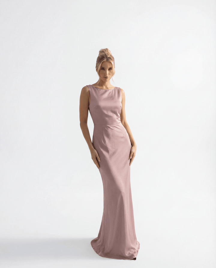 Karla™ long backless ceremony dress by Emma & Rose Cape Town, elegant abiti with flowing fabric and intricate design.