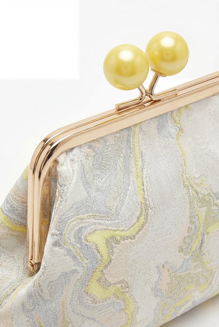 Emma & Rose Cape Town Simone™ elegant clutch bag with sophisticated closure, showcased in a stylish, compact design.