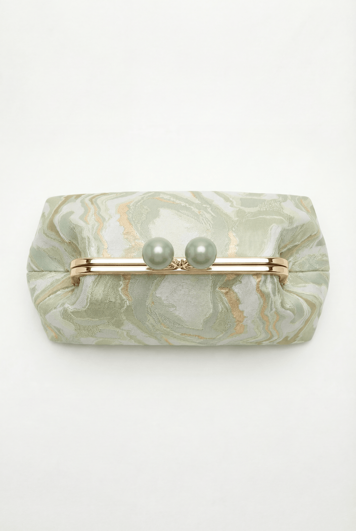 Emma & Rose Cape Town Simone™ elegant clutch bag with gold clasp closure, showcasing a sleek, stylish black leather design.