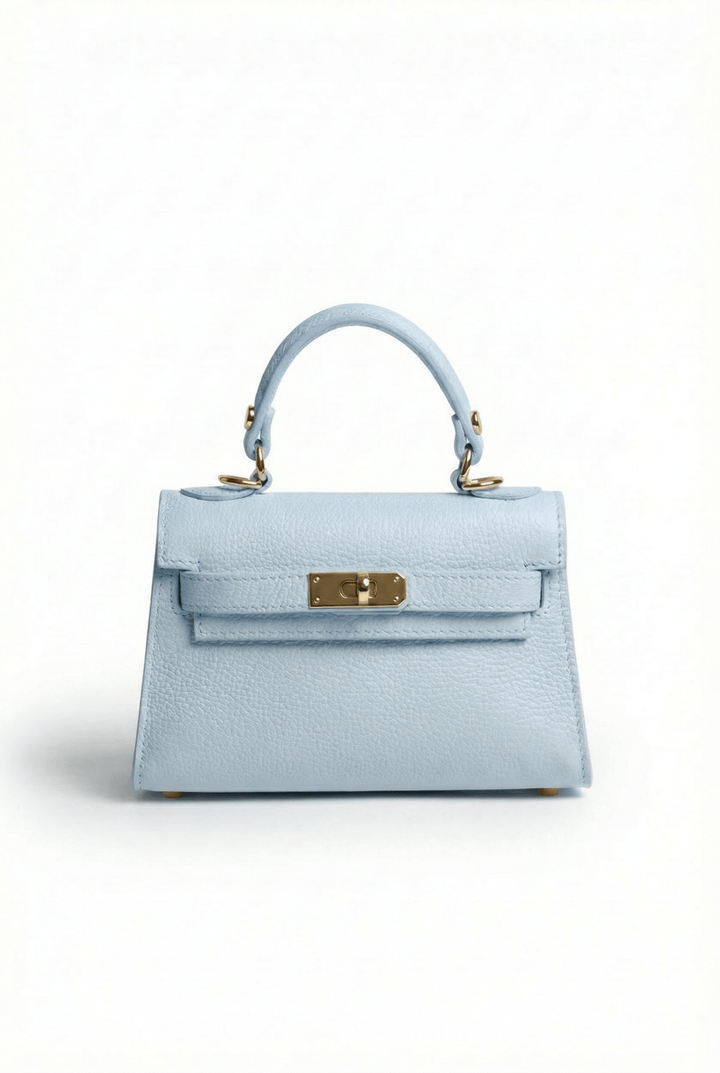 Emma & Rose Cape Town Handheld™ mini bag with sleek design, black leather exterior, and compact handheld style.